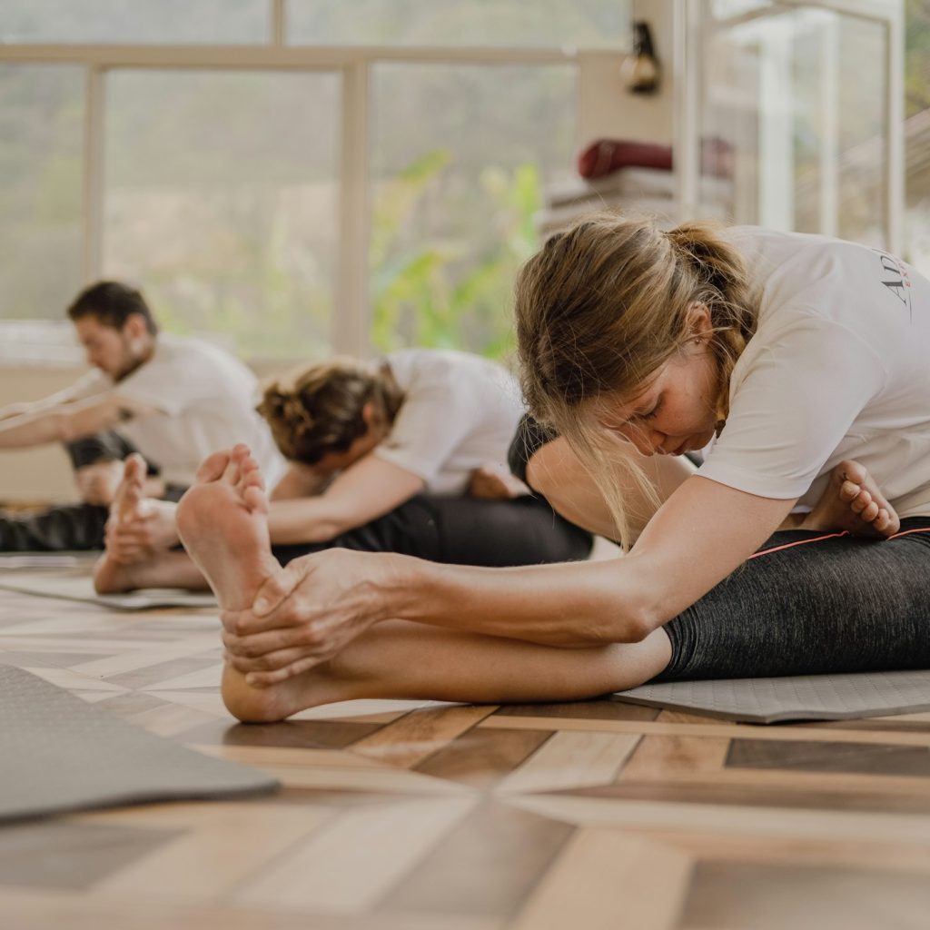 15-hour yoga training covering assists and adjustments
