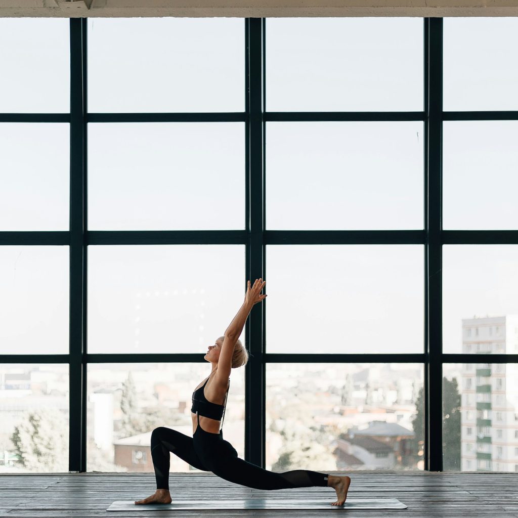 Trainee yoga teacher leading a class in Orpington